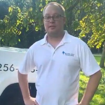 Carsten Carsten standing in front of a truck