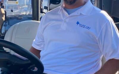 Jake is seen at work operating industrial equipment at a job site