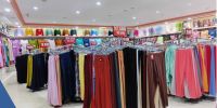 a retail lobby with racks of clothes for sale