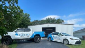 two branded vehicles in front of our office location
