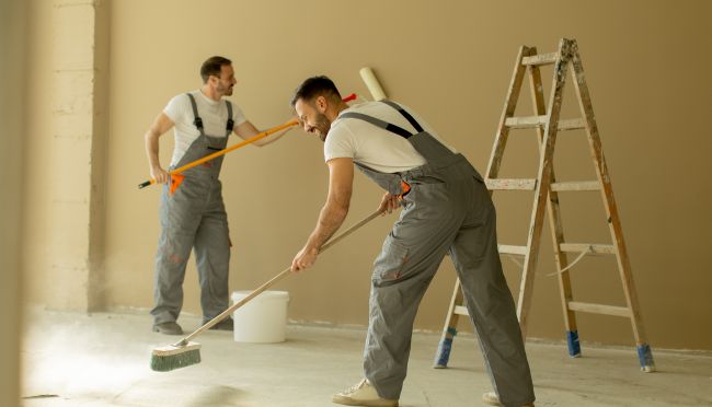 men painting the wall